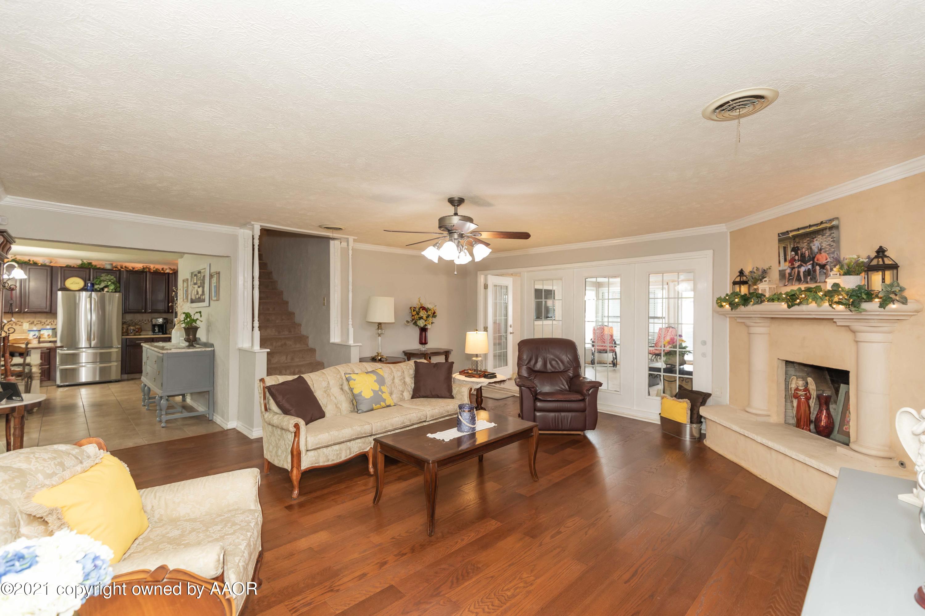 4707 Journey Street Amarillo, TX 79110 - Photo 26 of 65 a living room with furniture and a fireplace