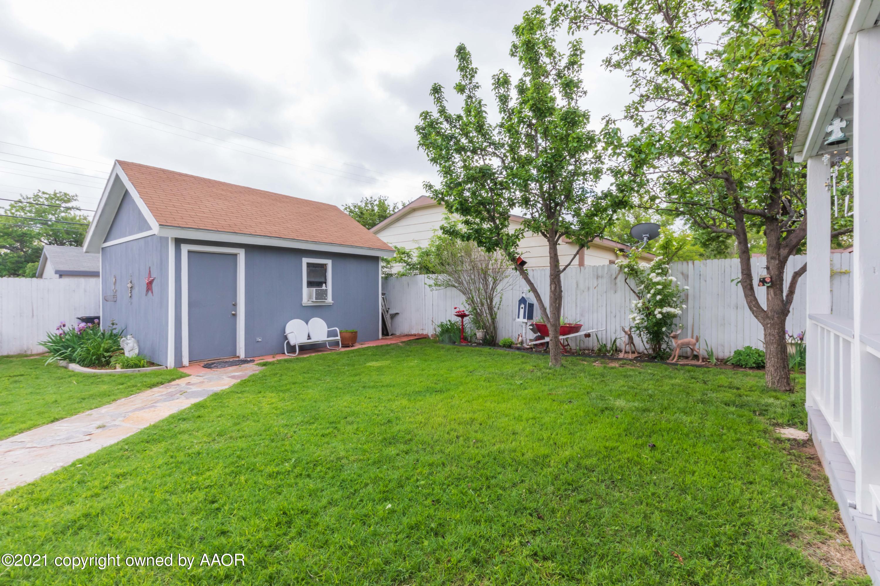 4707 Journey Street Amarillo, TX 79110 - Photo 4 of 65 a backyard of a house with plants and large tree