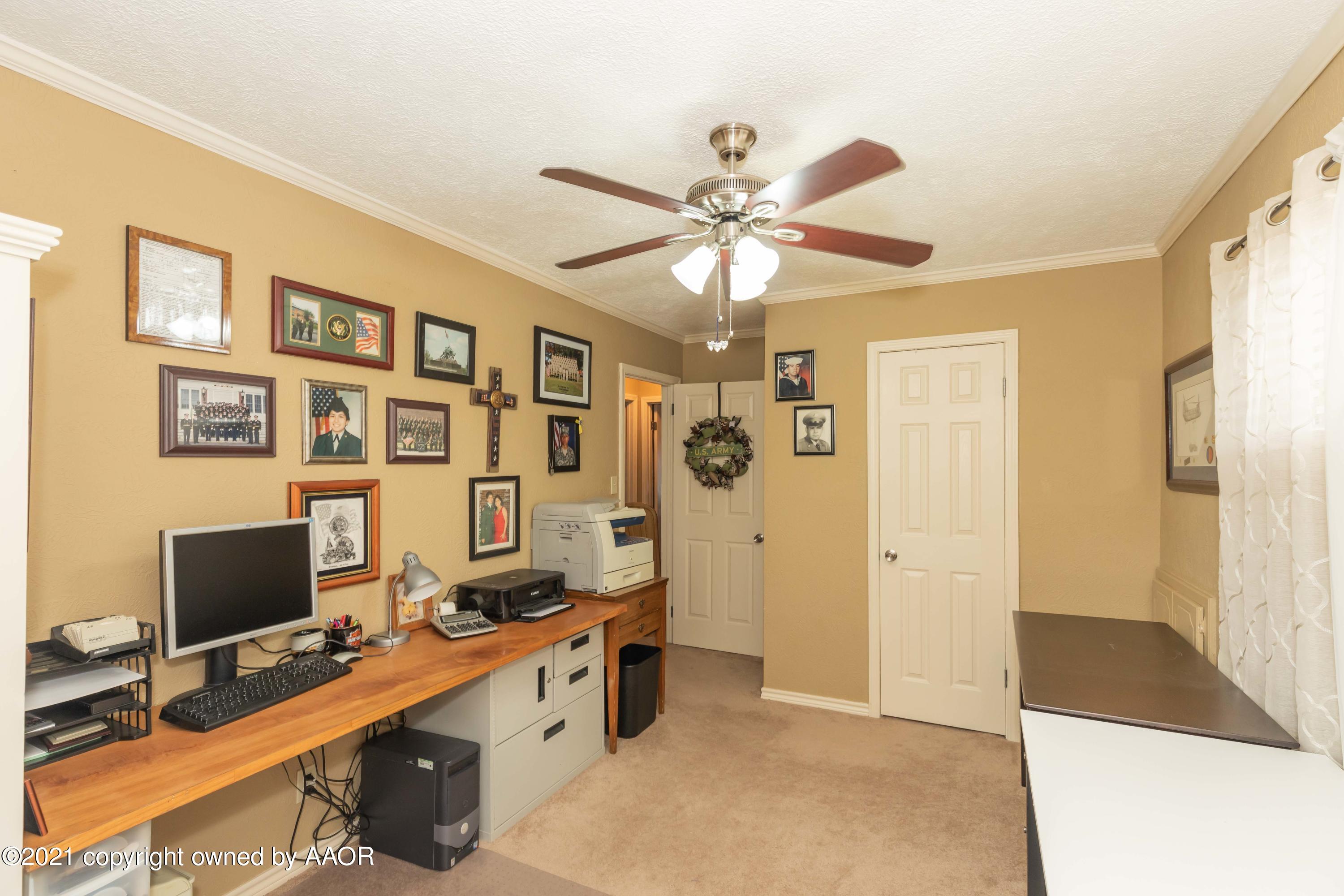 4707 Journey Street Amarillo, TX 79110 - Photo 44 of 65 a view of a workspace with furniture and a window