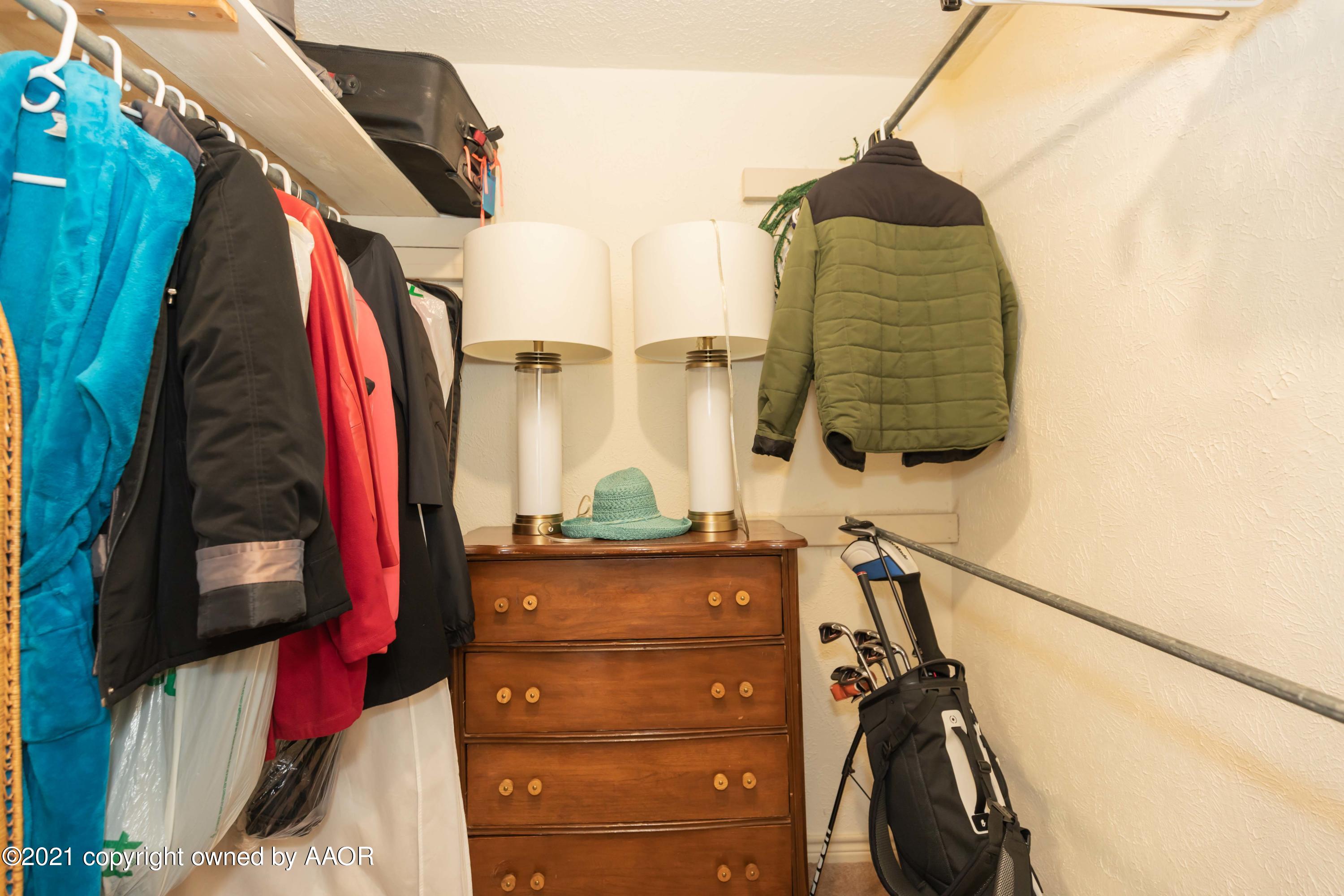 4707 Journey Street Amarillo, TX 79110 - Photo 48 of 65 a view of walk in closet with clothes and shoes