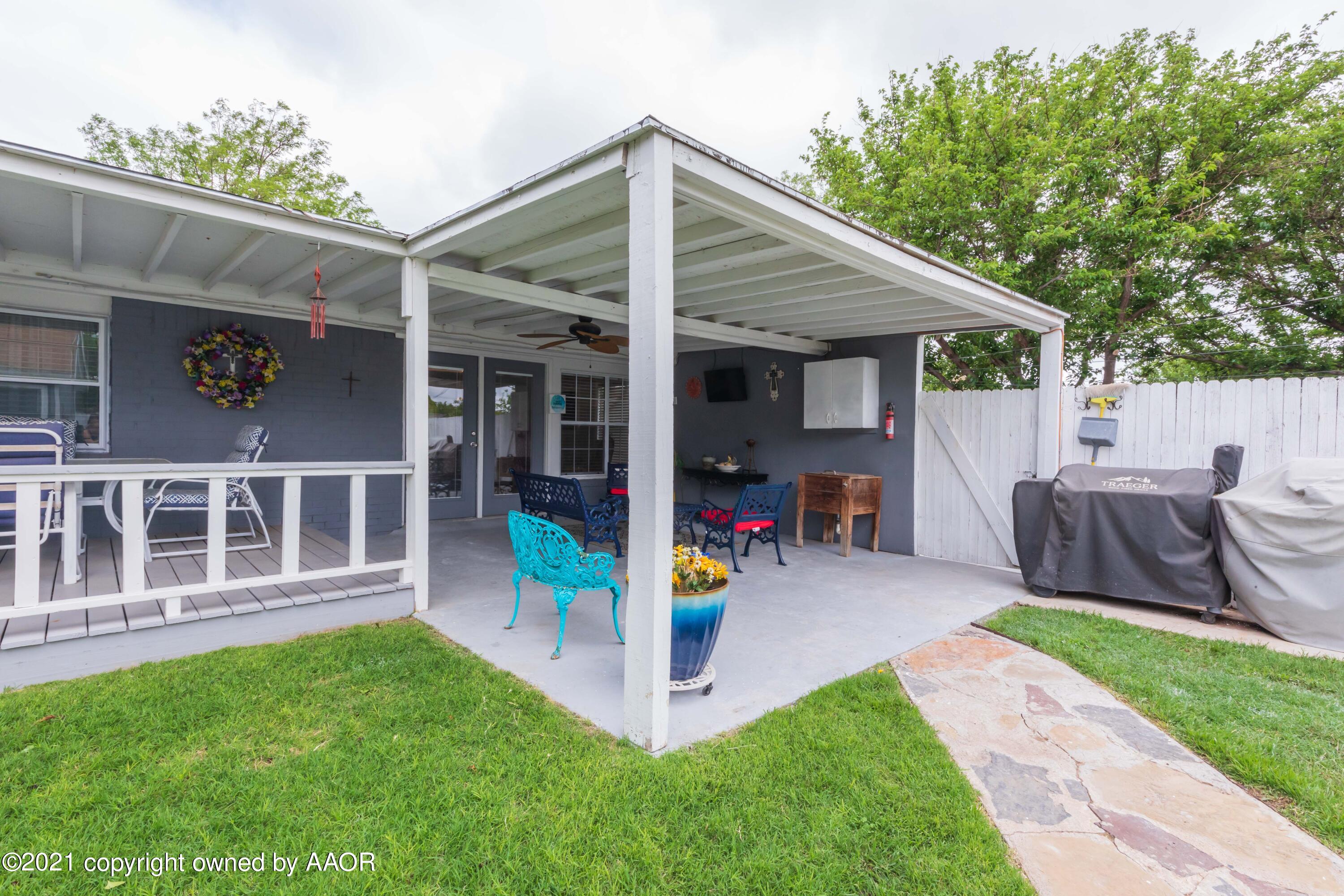 4707 Journey Street Amarillo, TX 79110 - Photo 57 of 65 a view of a house with a backyard and a patio