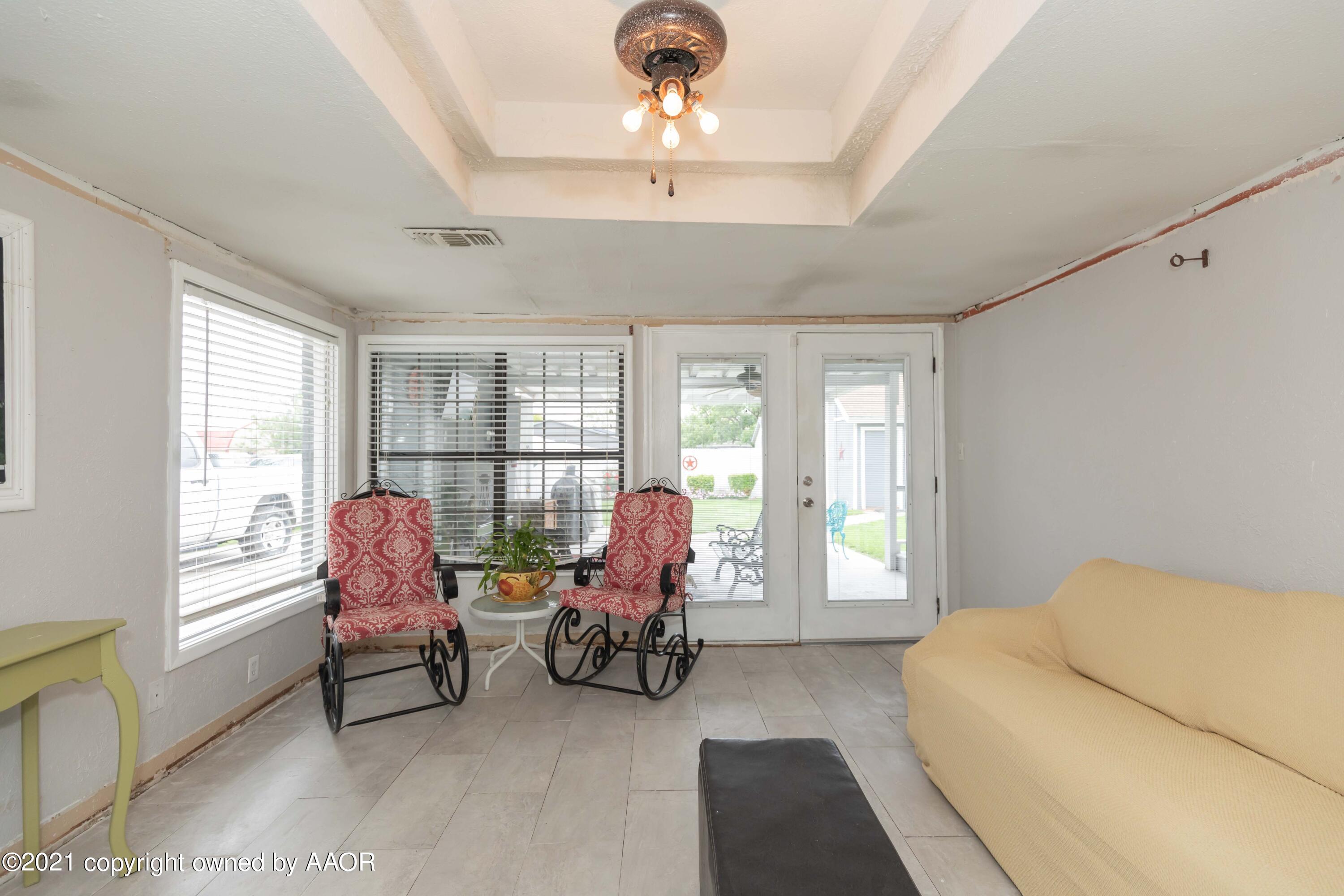 4707 Journey Street Amarillo, TX 79110 - Photo 61 of 65 a bedroom with furniture and large windows