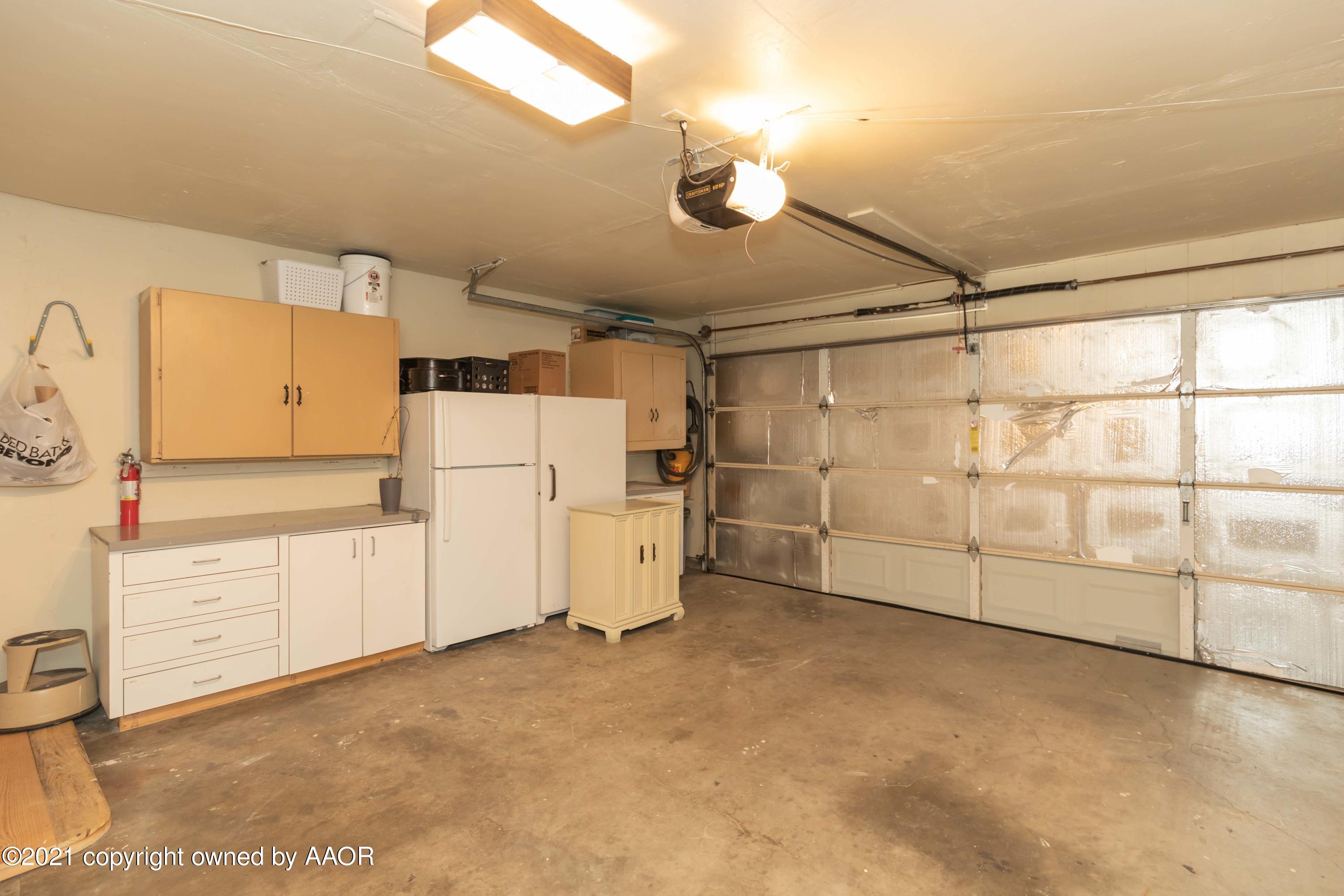 4707 Journey Street Amarillo, TX 79110 - Photo 64 of 65 a view of storage and utility room with washer and dryer