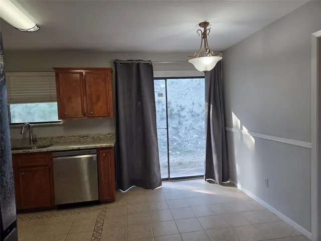 a kitchen with stainless steel appliances granite countertop a stove and a refrigerator
