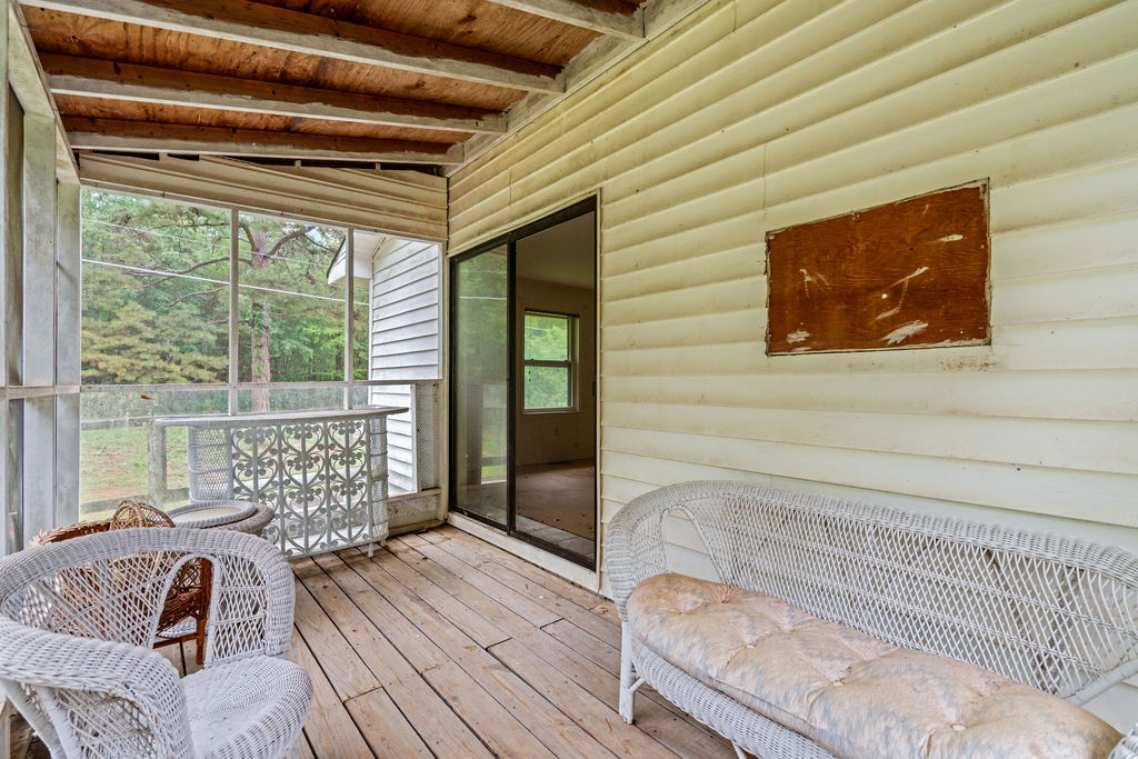 712 Whitney Way Anderson, SC 29625 - Photo 28 of 31 A tranquil screened porch with wooden decking invites relaxation and enjoyment of the natural surroundings.