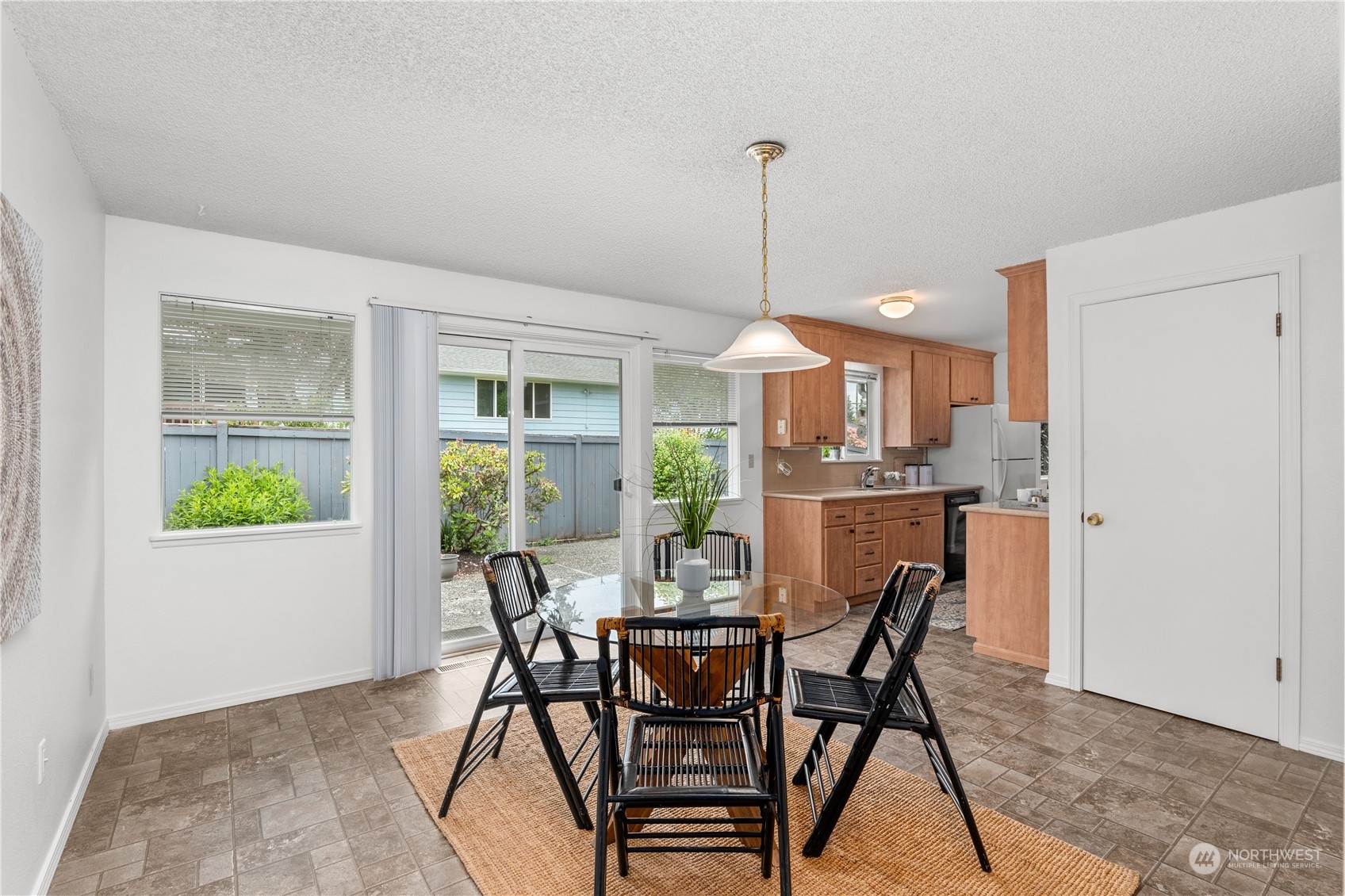 10616 Northeast 194th Street Bothell, WA 98011 - Photo 11 of 29 a view of a dining room with furniture window and outside view