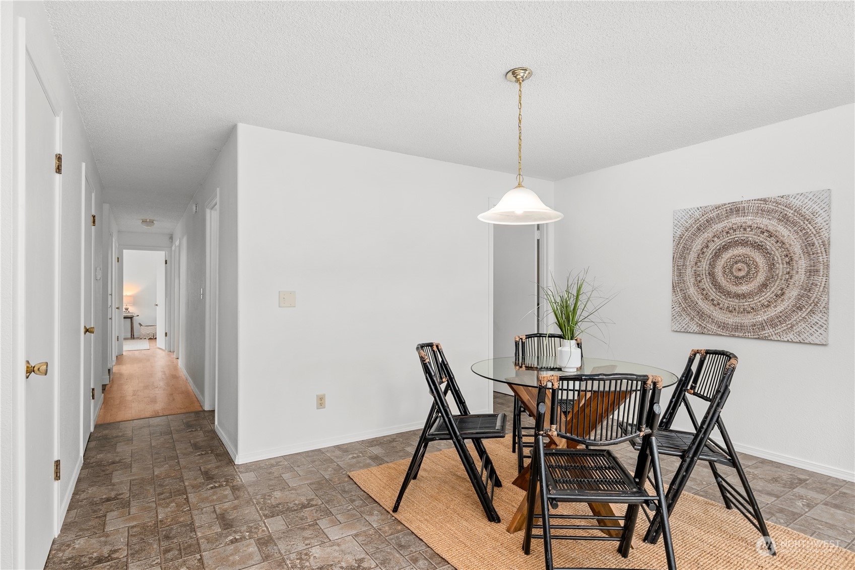 10616 Northeast 194th Street Bothell, WA 98011 - Photo 12 of 29 a view of a dining room with furniture and wooden floor