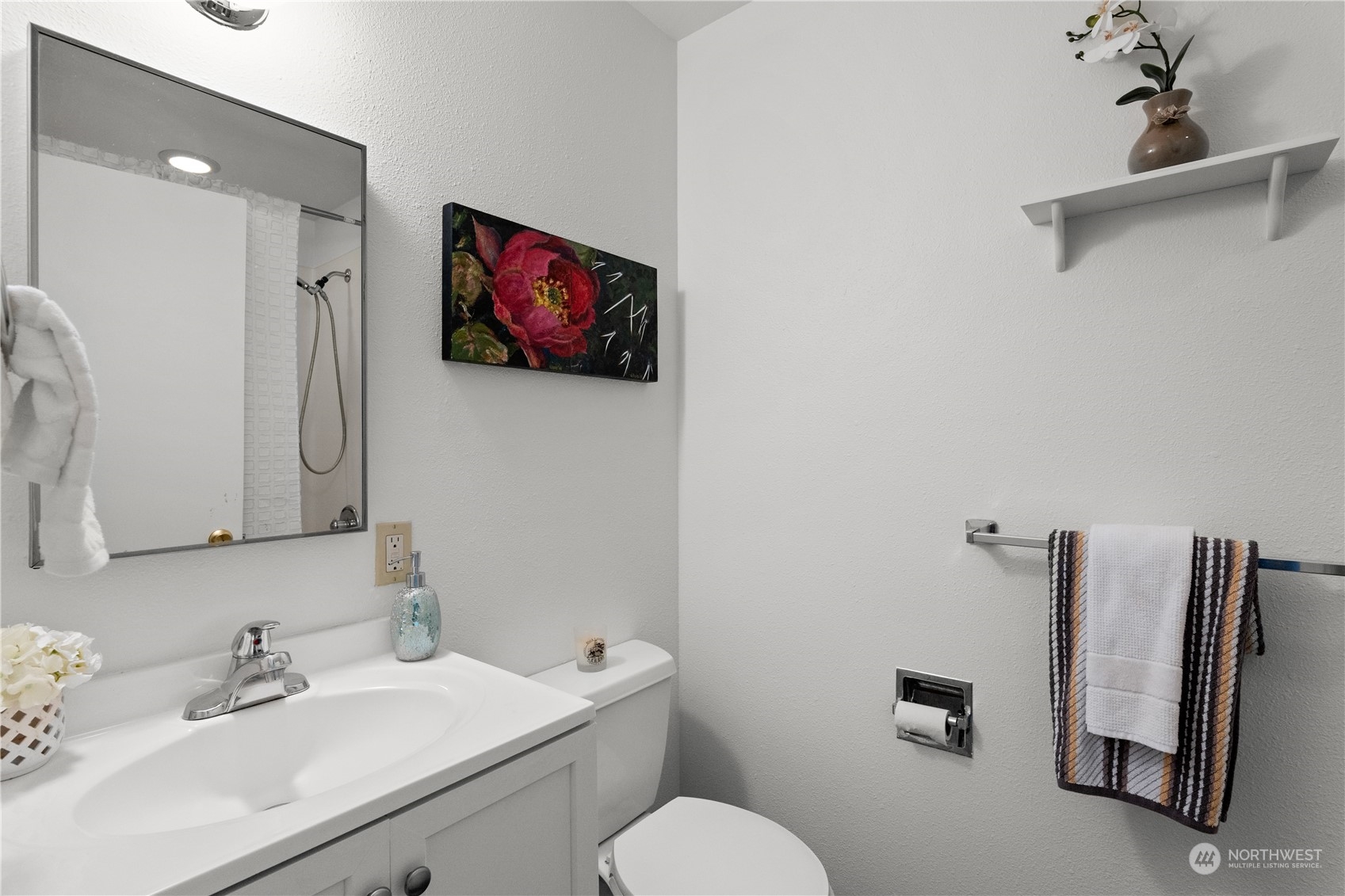 10616 Northeast 194th Street Bothell, WA 98011 - Photo 19 of 29 a bathroom with a sink mirror and toilet