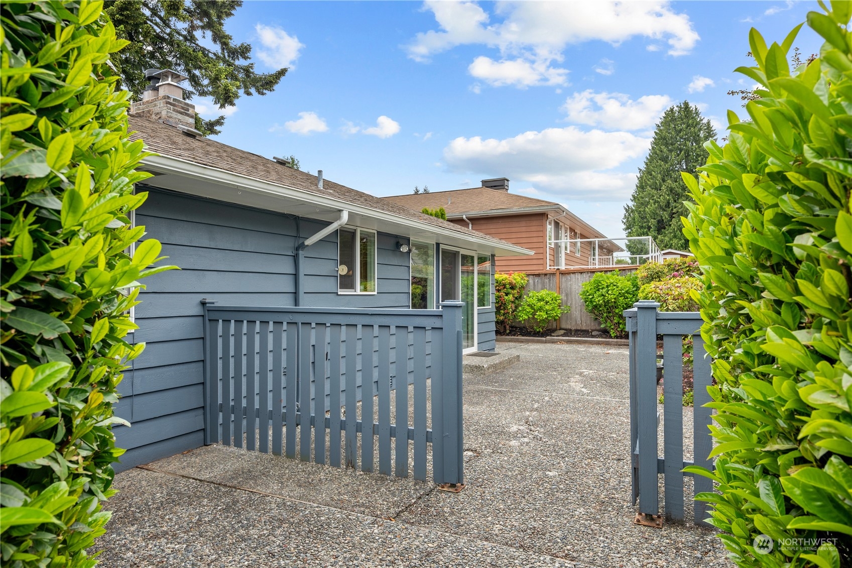10616 Northeast 194th Street Bothell, WA 98011 - Photo 23 of 29 a front view of a house with a garden