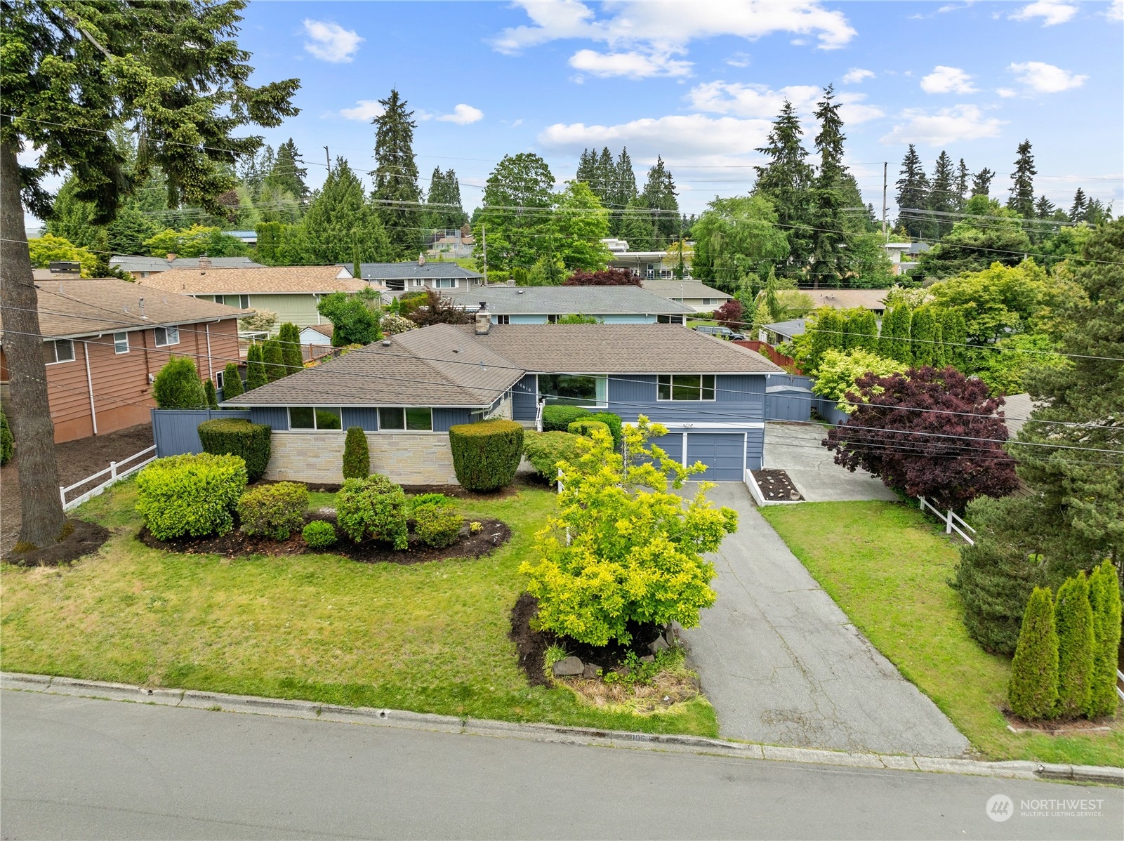 10616 Northeast 194th Street Bothell, WA 98011 - Photo 25 of 29 a front view of a house with a yard