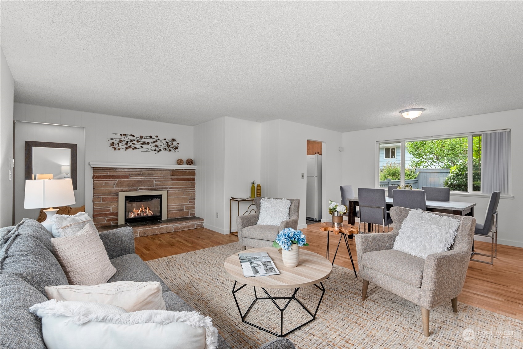 10616 Northeast 194th Street Bothell, WA 98011 - Photo 3 of 29 a living room with furniture and a fireplace
