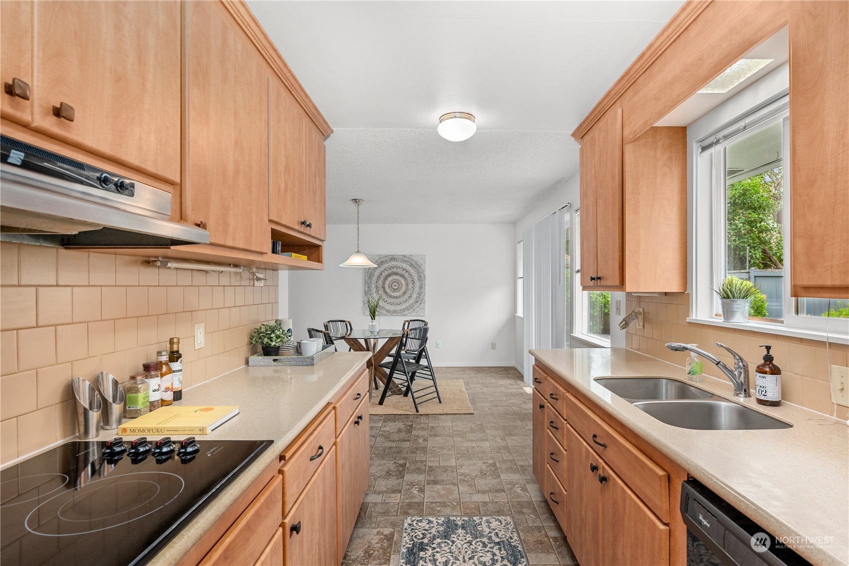 10616 Northeast 194th Street Bothell, WA 98011 - Photo 9 of 29 a kitchen with a sink stove and cabinets