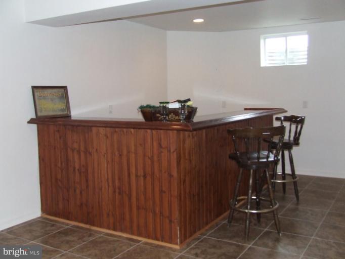 8312 Banister Road Severn, MD 21144 - Photo 8 of 21 a view of a dining room with furniture and wooden floor