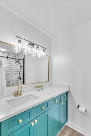 a bathroom with a double vanity sink mirror and double