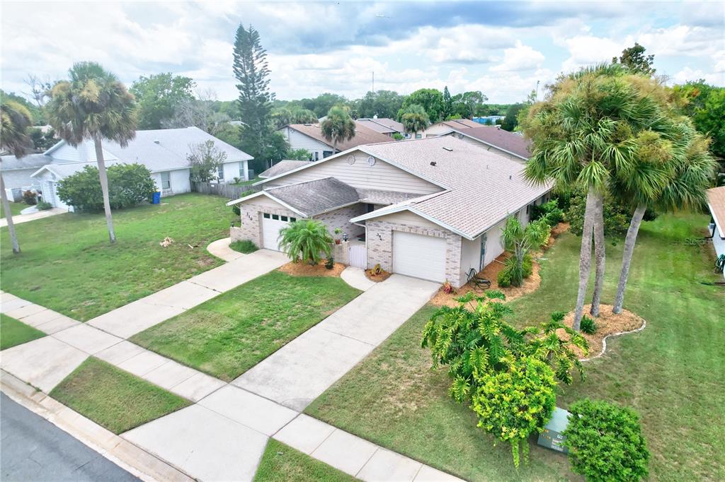 306 Paradise Lane Edgewater, FL 32132 - Photo 1 of 1 a aerial view of a house with garden
