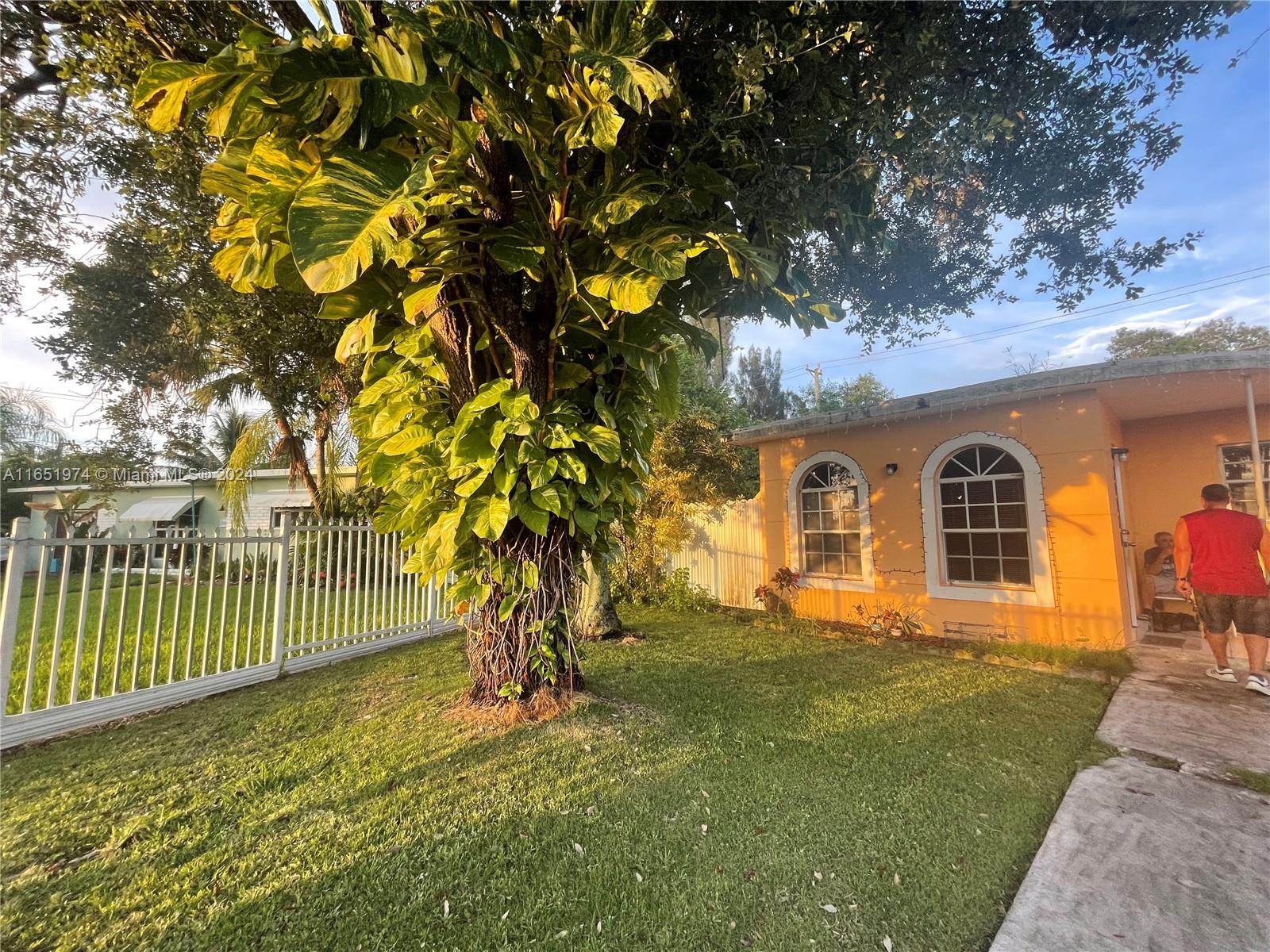 29361 Maine Road Homestead, FL 33033 - Photo 1 of 12 a front view of a house with a garden