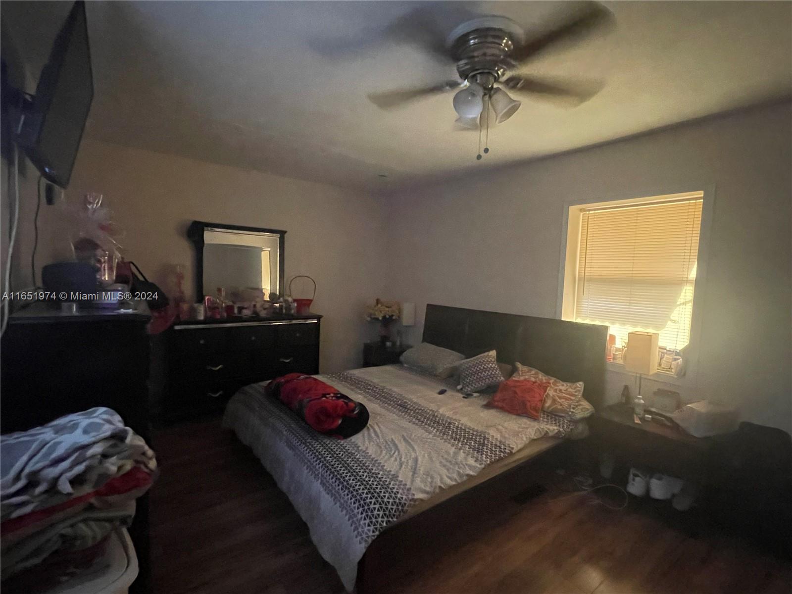 29361 Maine Road Homestead, FL 33033 - Photo 7 of 12 a bedroom with a bed and dresser