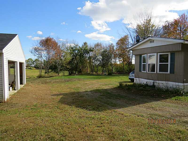 281 Hunts Meadow Road Whitefield, ME 04353 - Photo 4 of 20 Exterior Side View.