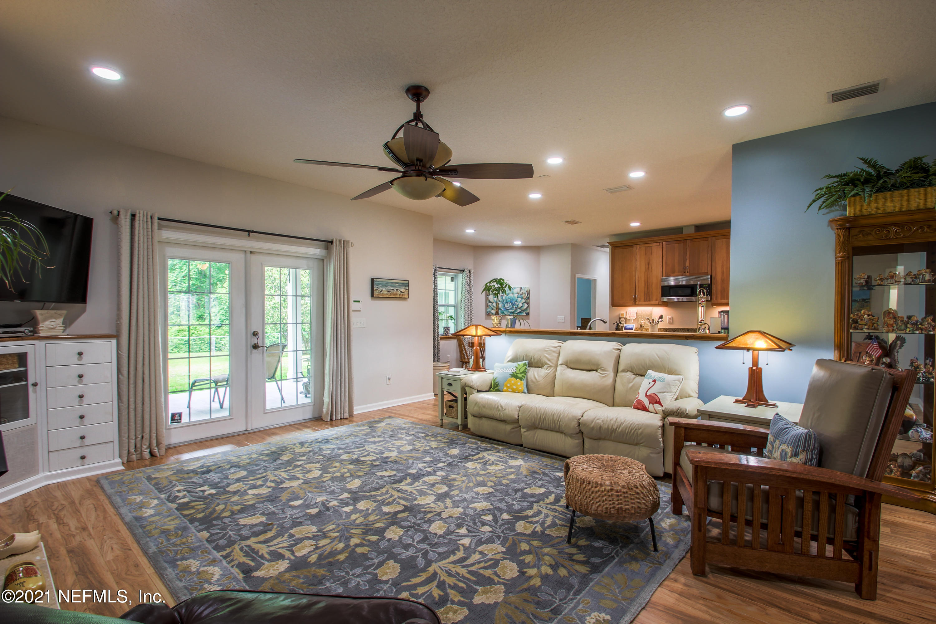 1386 Long Bay Road Middleburg, FL 32068 - Photo 11 of 40 a living room with furniture and a flat screen tv