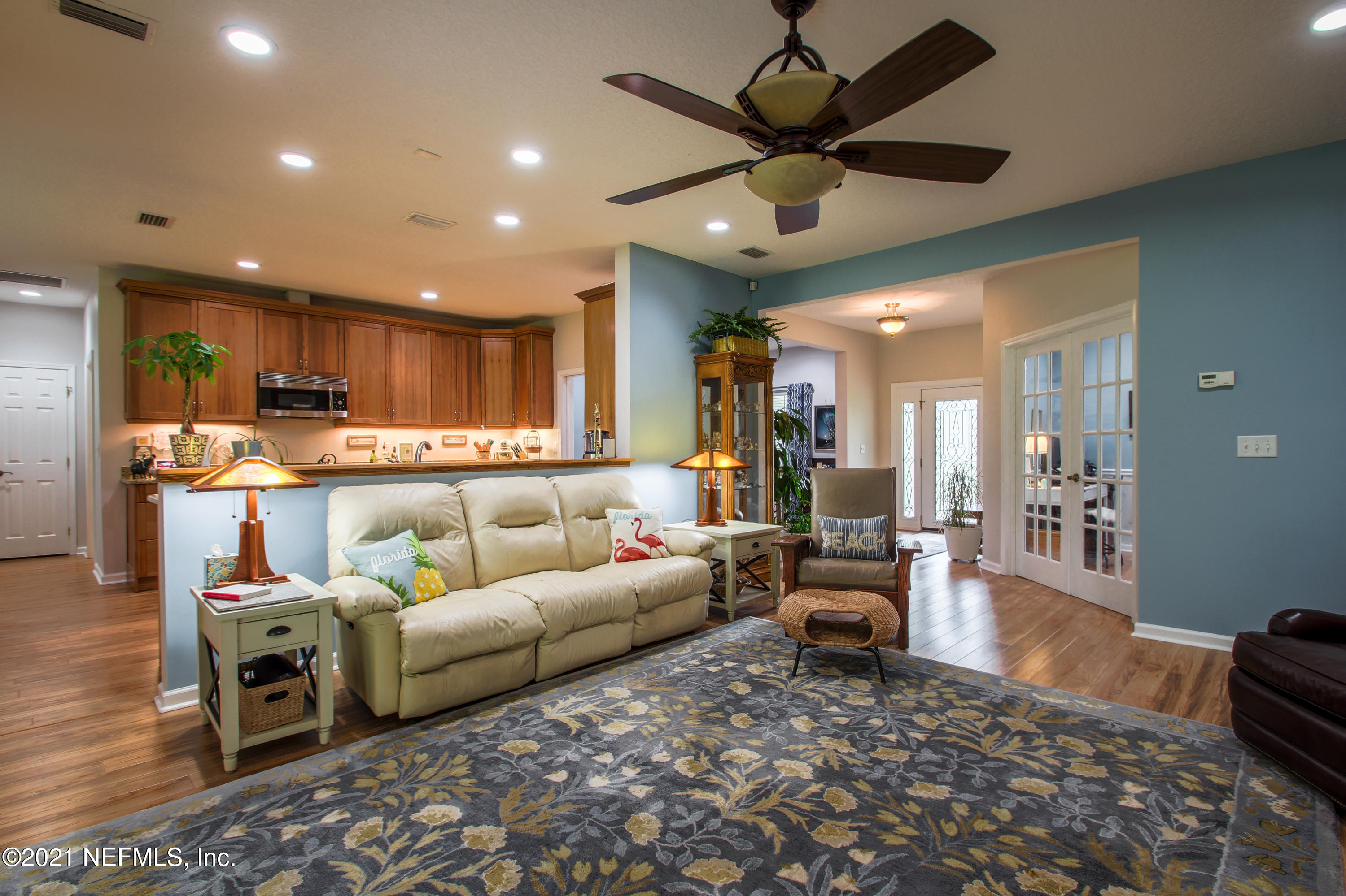 1386 Long Bay Road Middleburg, FL 32068 - Photo 12 of 40 a living room with furniture and a view of kitchen