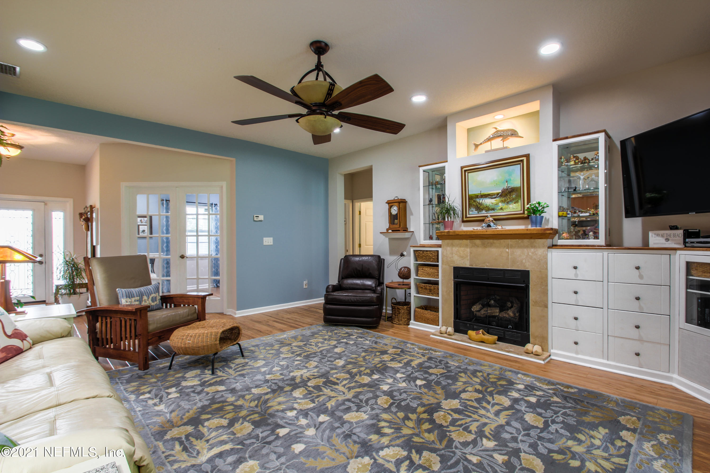 1386 Long Bay Road Middleburg, FL 32068 - Photo 13 of 40 a living room with furniture and a fireplace