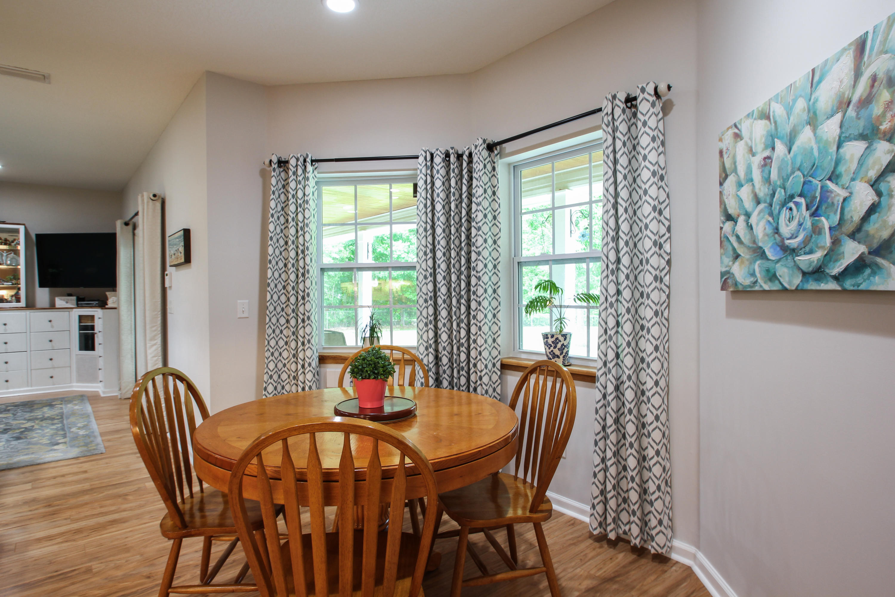 1386 Long Bay Road Middleburg, FL 32068 - Photo 18 of 40 a view of a dining room with furniture window and wooden floor