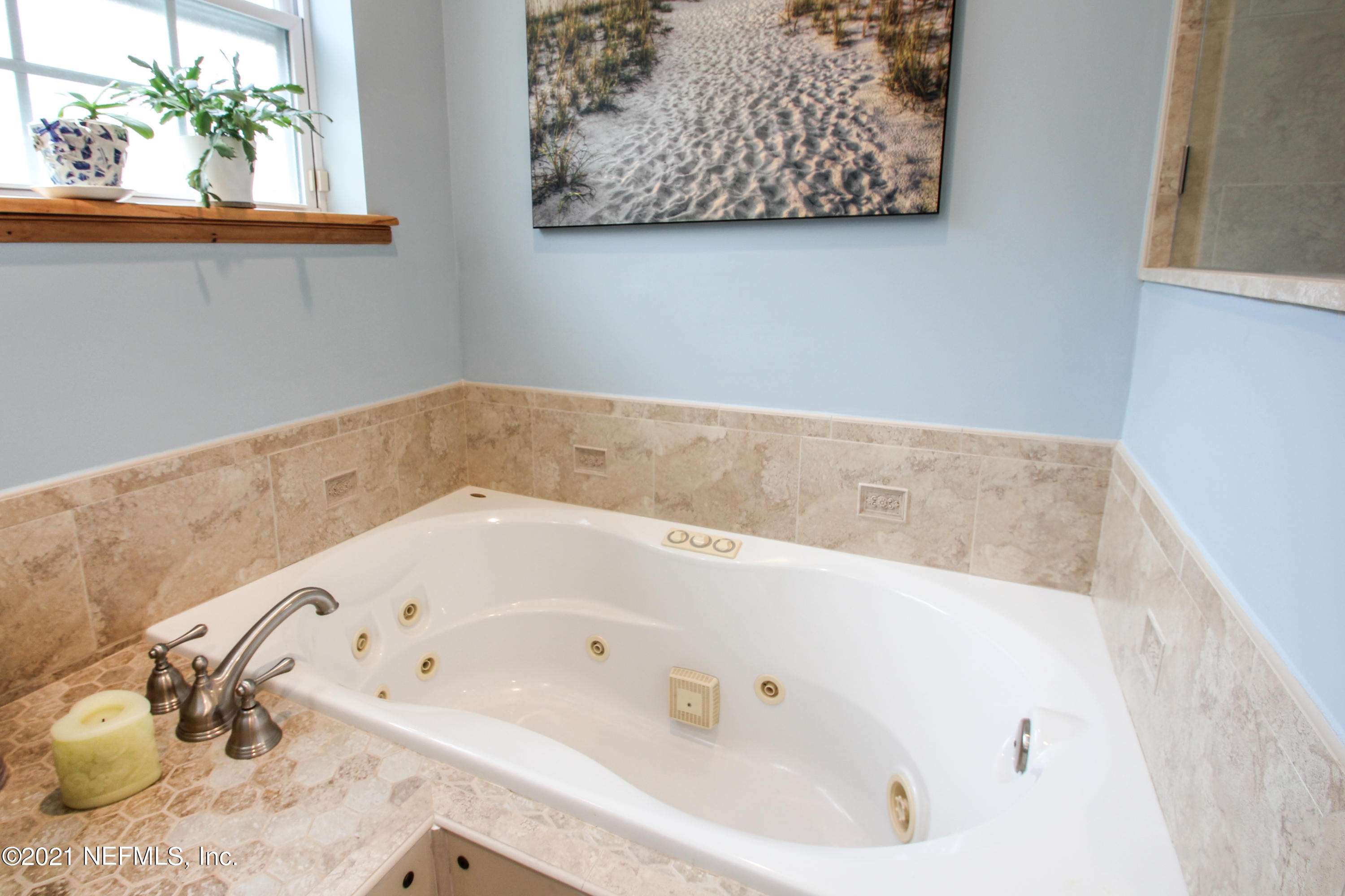 1386 Long Bay Road Middleburg, FL 32068 - Photo 23 of 40 a bathroom with a bathtub and shower