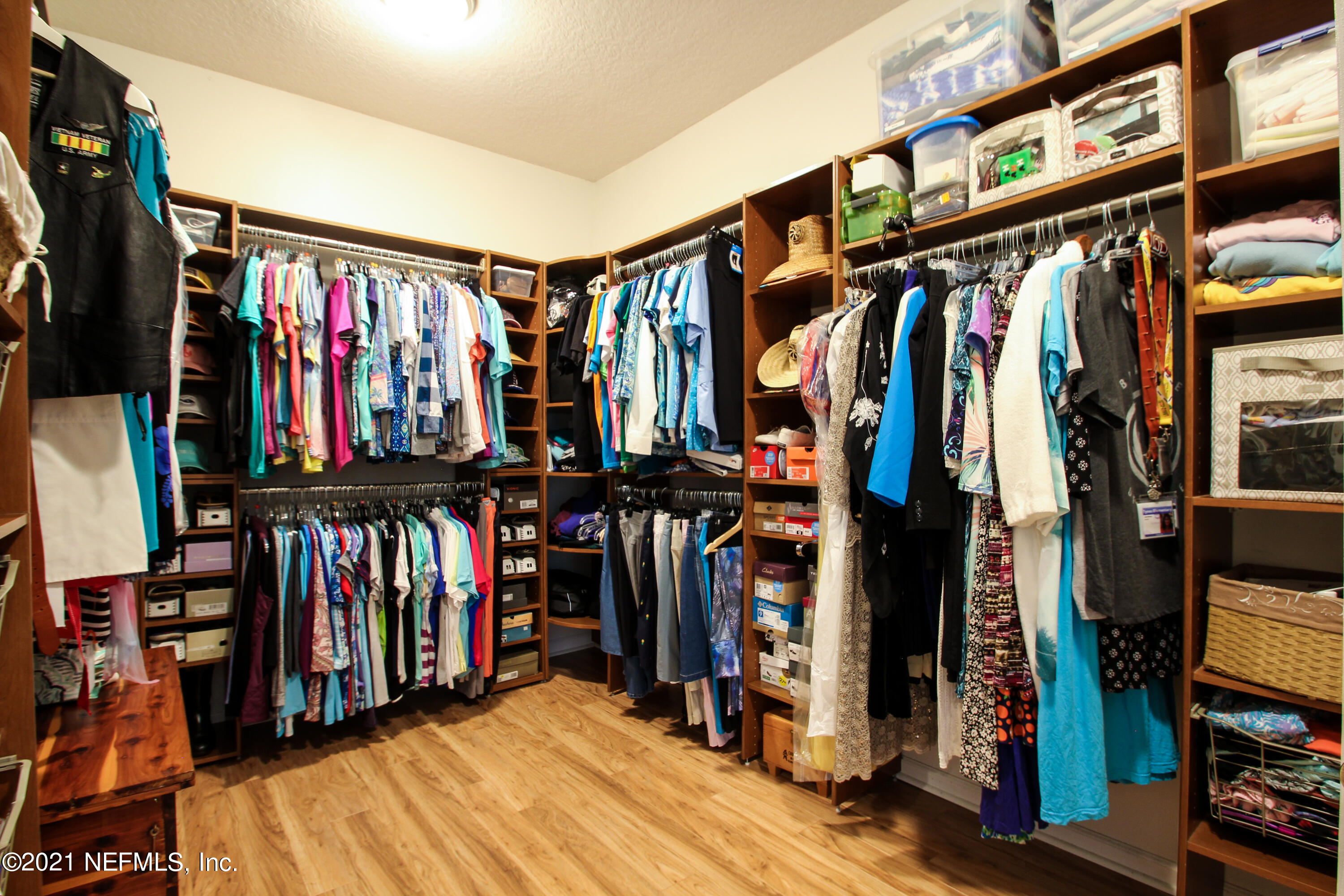 1386 Long Bay Road Middleburg, FL 32068 - Photo 25 of 40 a view of walk in closet with clothes and shoes