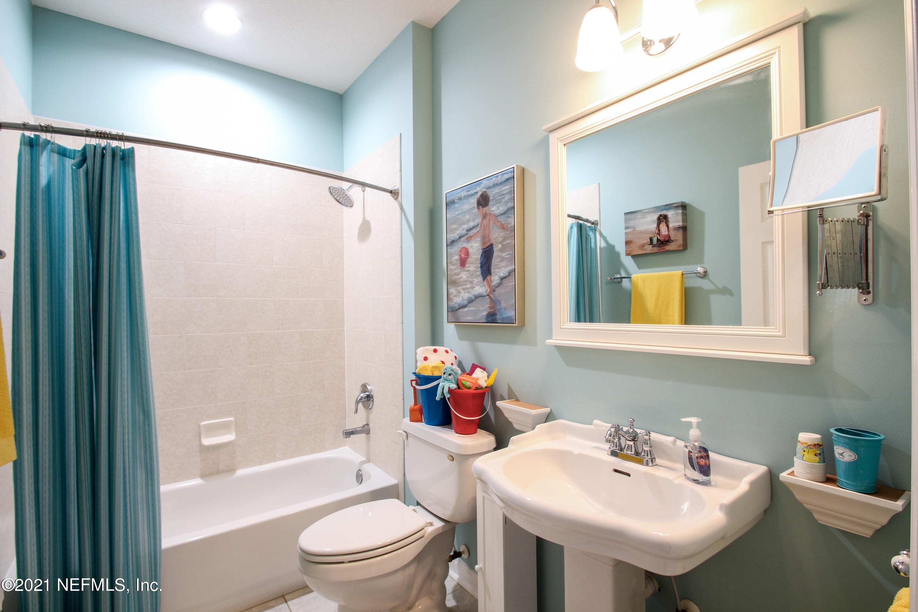 1386 Long Bay Road Middleburg, FL 32068 - Photo 27 of 40 a bathroom with a sink toilet and shower