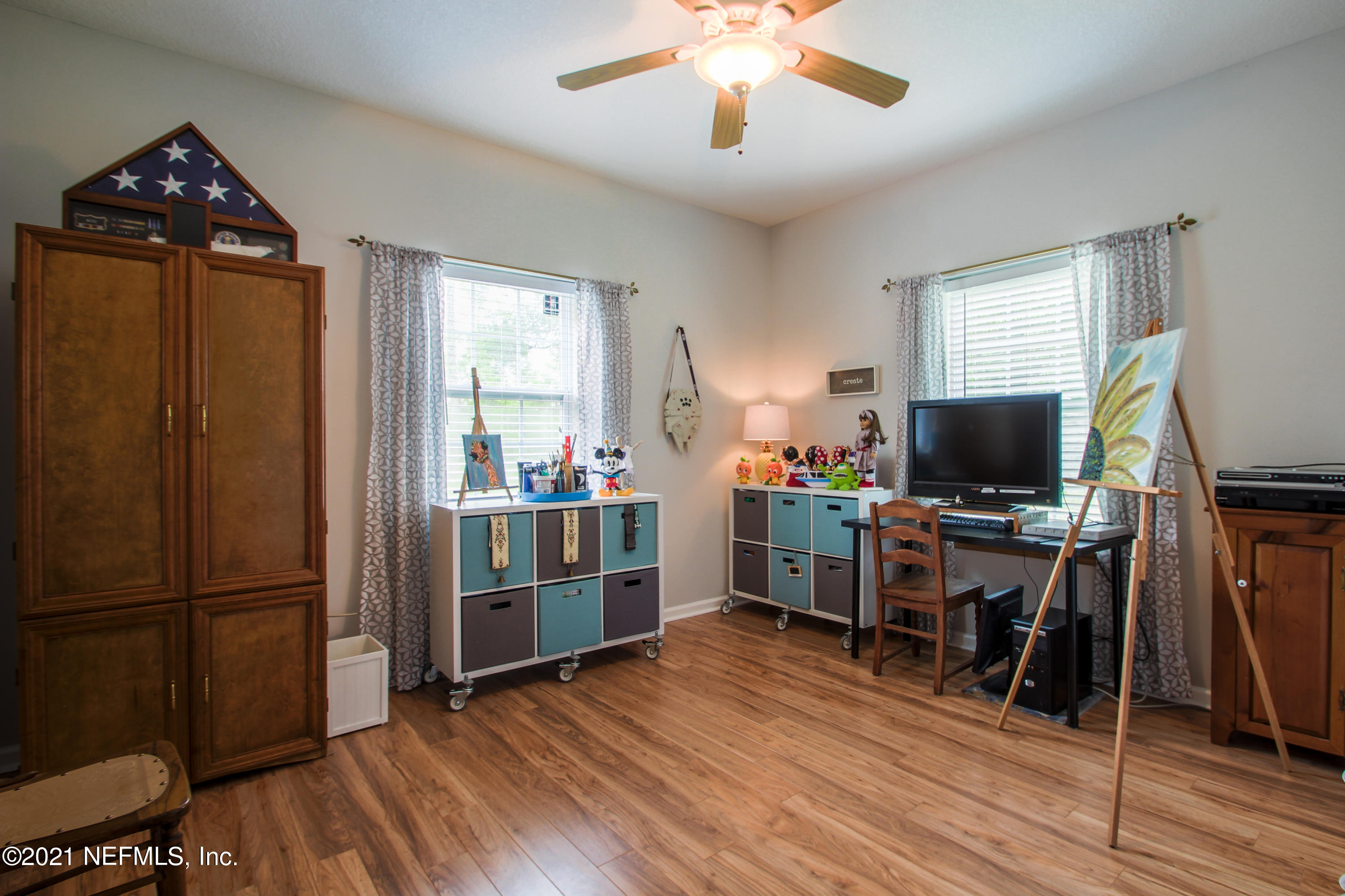 1386 Long Bay Road Middleburg, FL 32068 - Photo 28 of 40 a view of a workspace with furniture and wooden floor