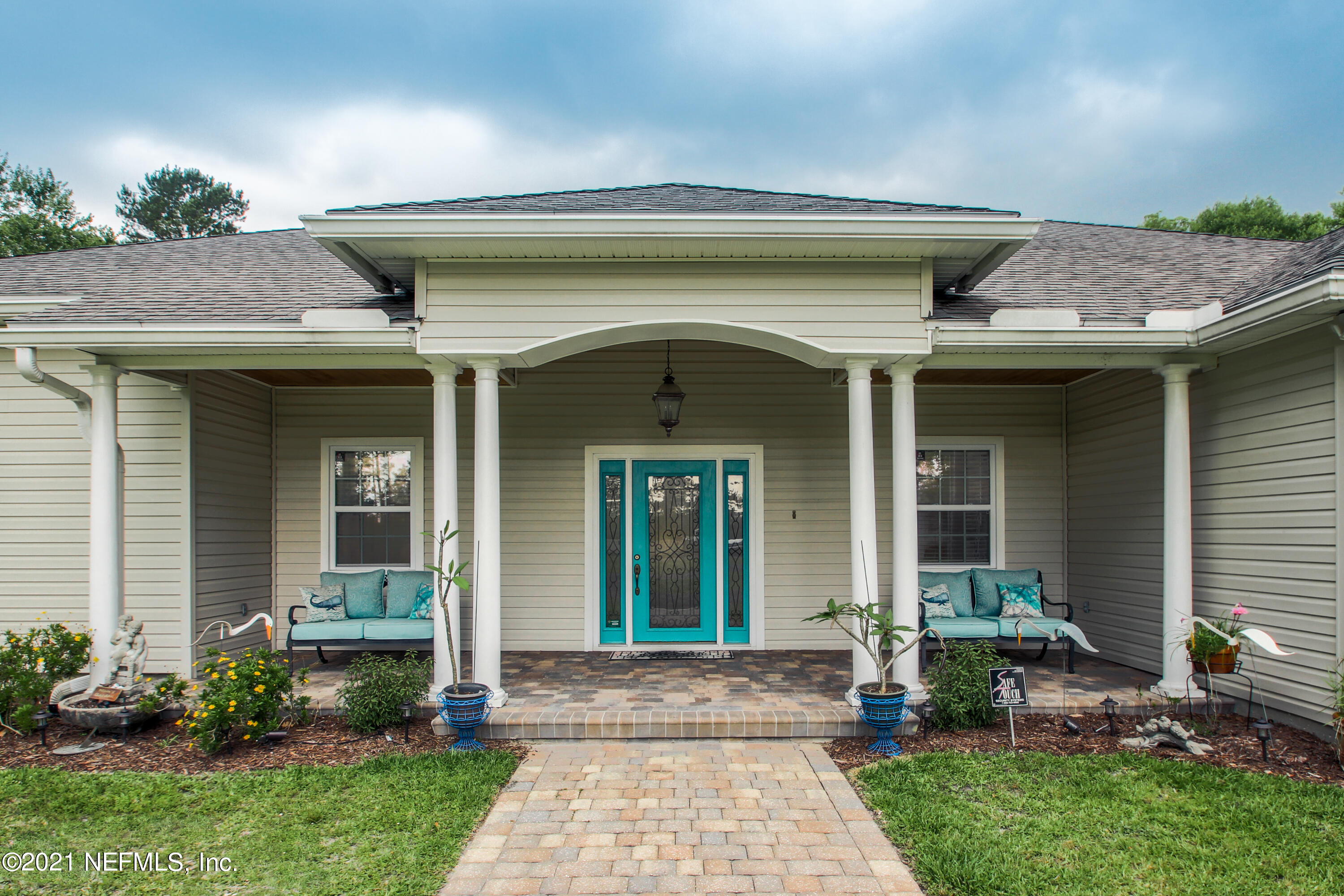 1386 Long Bay Road Middleburg, FL 32068 - Photo 5 of 40 a front view of a house with garden