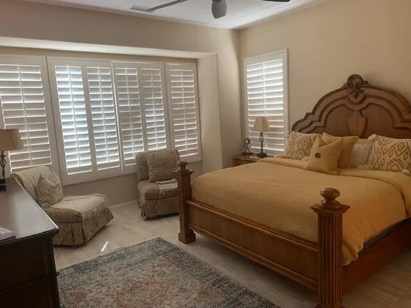 a bedroom with a bed and a couch
