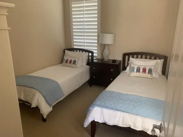 a bedroom with a bed and window