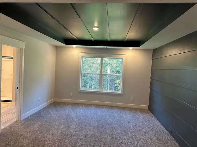 a bathroom with a sink a mirror a vanity and a shower
