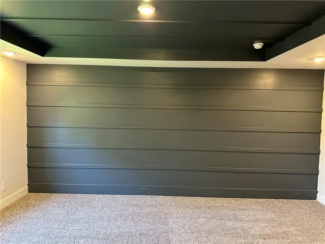 a view of bathroom with a tub and shower