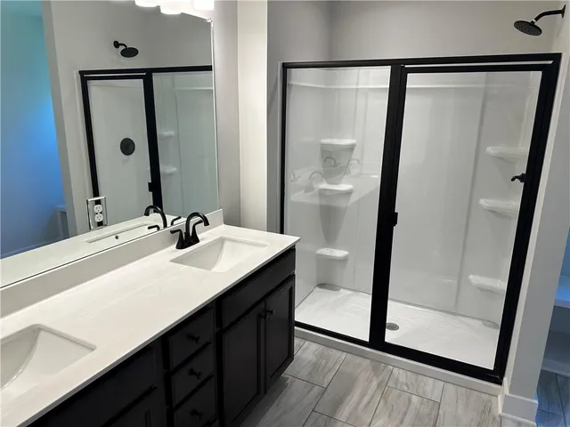 a bathroom with a sink a toilet and mirror