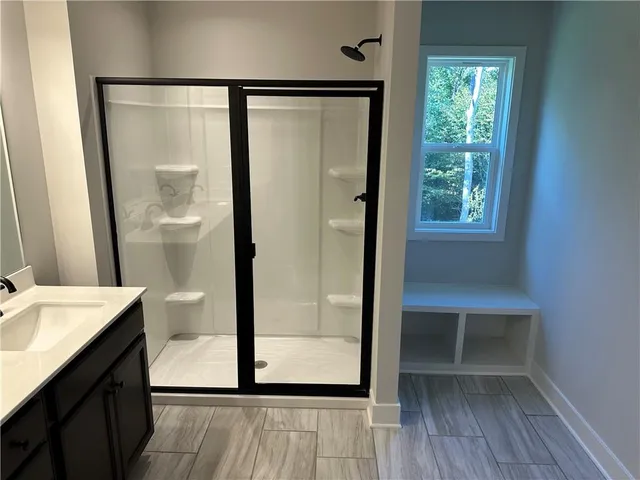 a white toilet sitting next to a bath tub