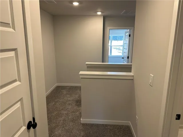 a sign that is sitting in the middle of a park