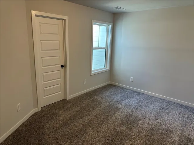 a front view of a building with garden