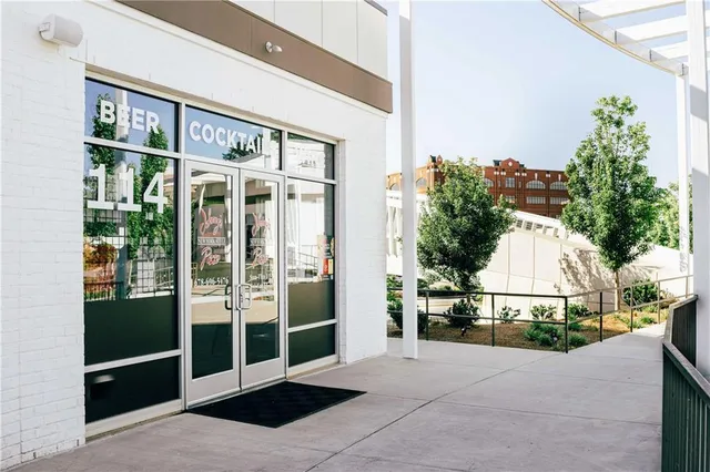 a view of a building with a window and a ceiling fan