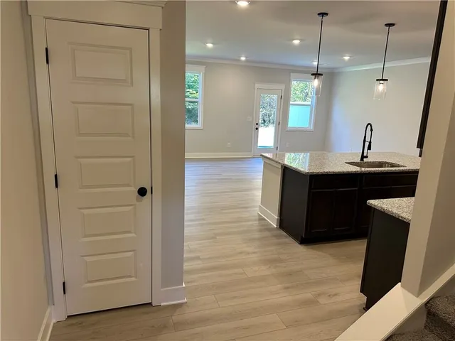 a view of a kitchen counter space and wooden floor