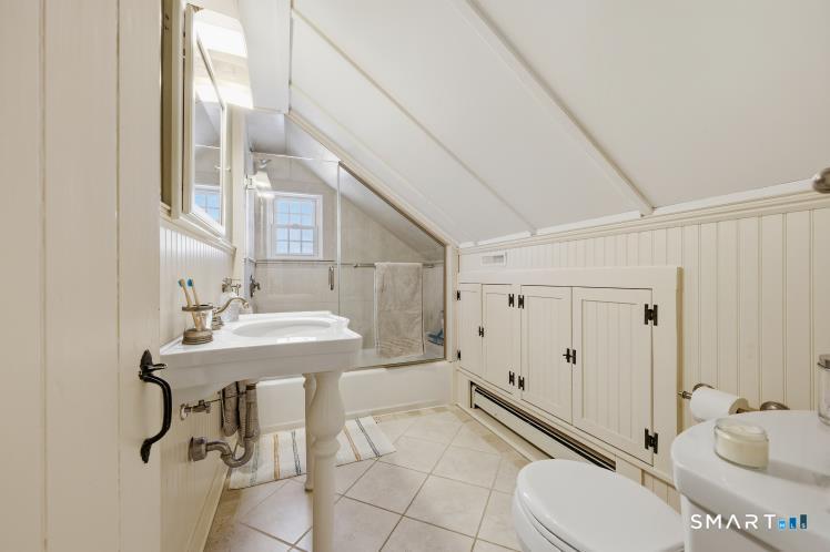 402 Boston Street Guilford, CT 06437 - Photo 27 of 40 2nd floor full tub/shower with fully filed area and custom glass shower door