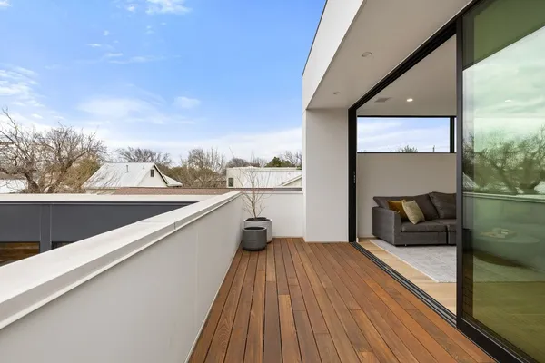 a view of balcony with furniture