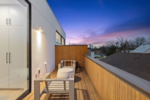 a view of balcony with furniture