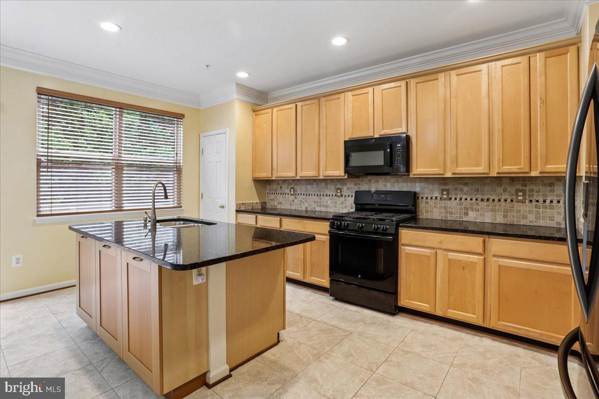 2943 St Helen Circle Silver Spring, MD 20906 - Photo 13 of 40 Modern kitchen with warm wood tones.