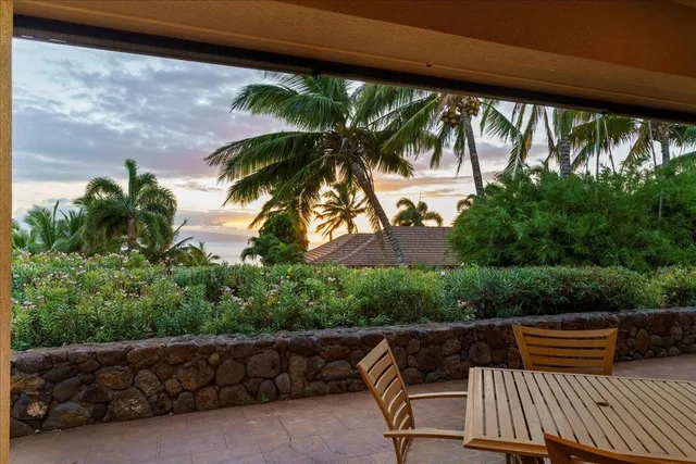 a view of balcony with furniture and garden