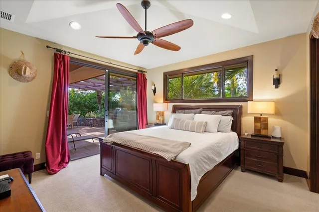 a bedroom with a large bed and a large window