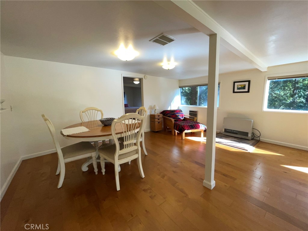 21455 Delta Way, Unit 2 Monte Rio, CA 95462 - Photo 13 of 48 a dining room with furniture and wooden floor