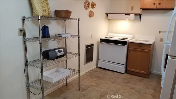 a kitchen with a sink and a refrigerator