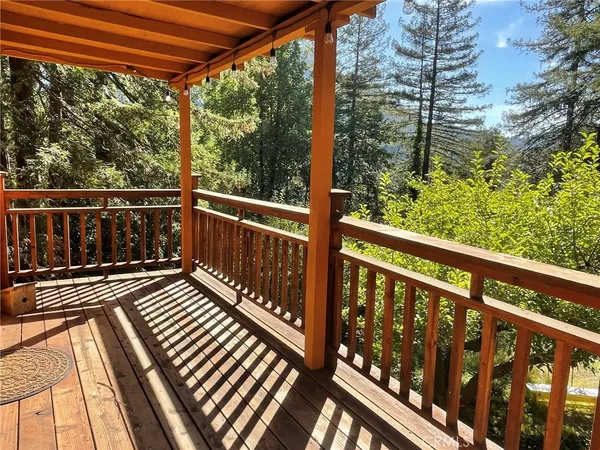 a view of balcony with wooden floor